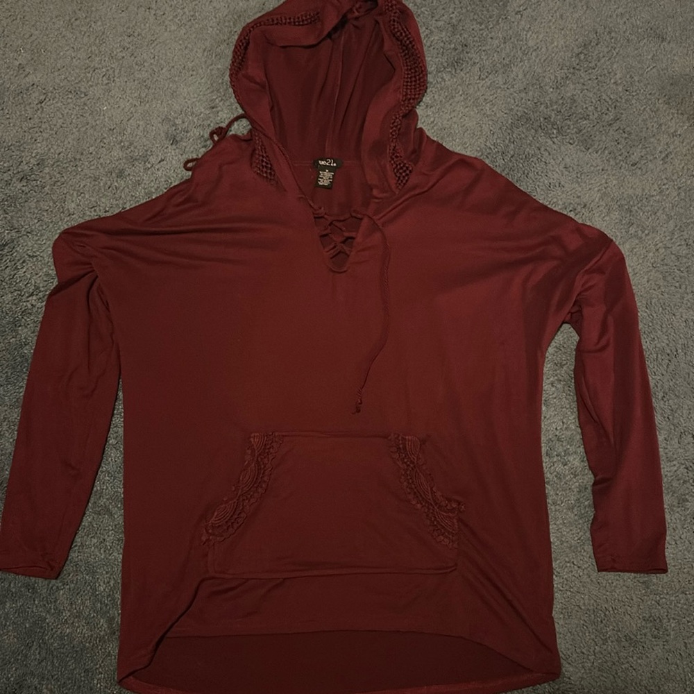 Burgundy hooded pullover with pocket. 92% polyester 8% spandex